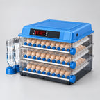 Ovatekly Home 48-egg automatic incubator on a light grey studio background, with its two external water bottles